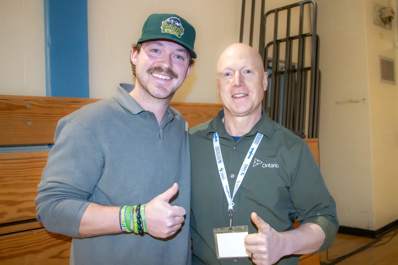 Two conference attendees posing together